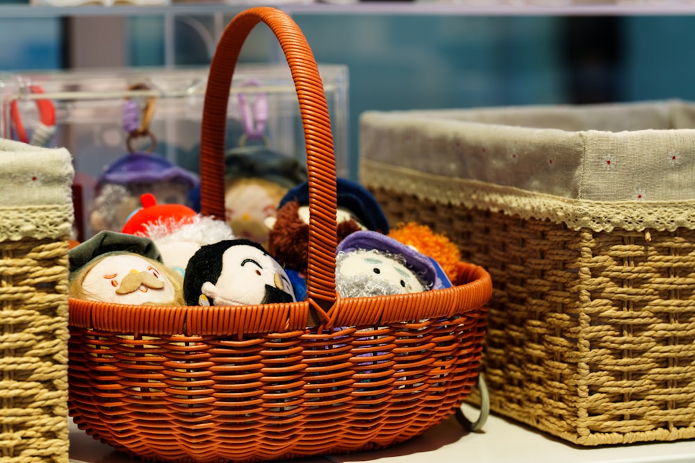 A woven basket filled with small plush toys