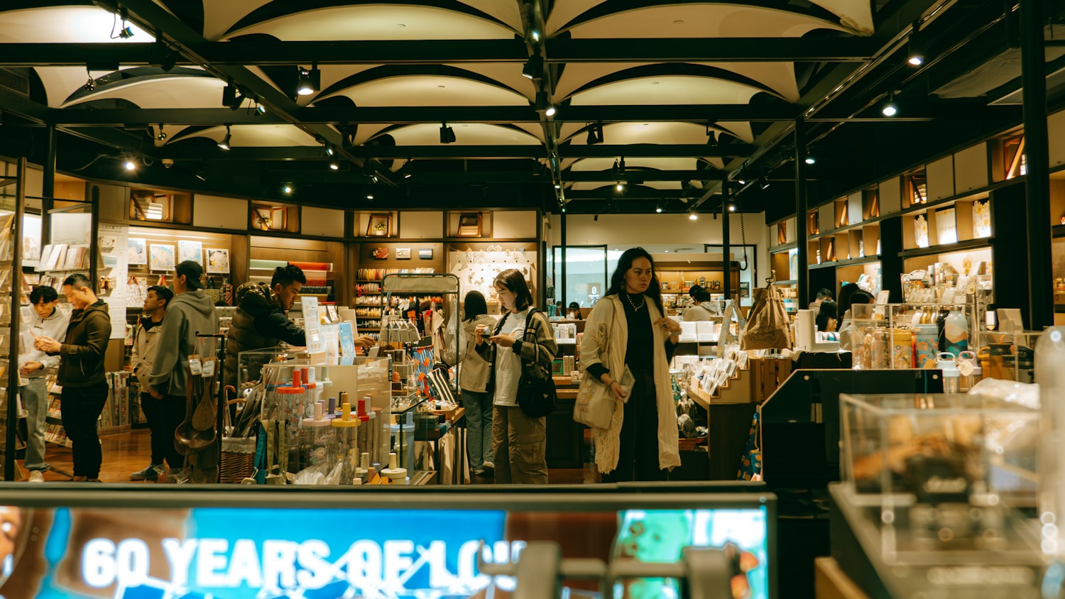 People browsing inside a well-lit shop