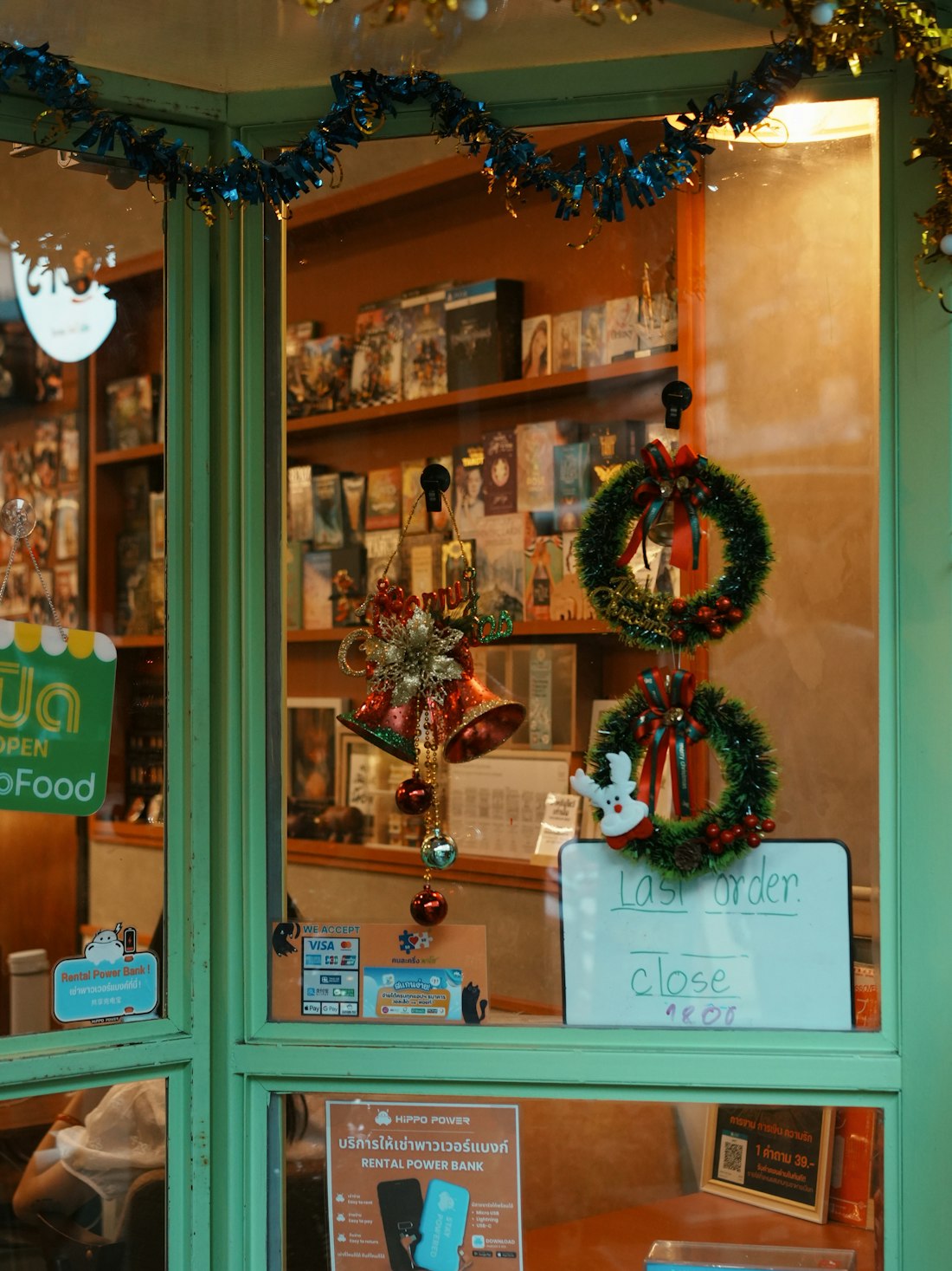A shop window display glowing warmly at dusk