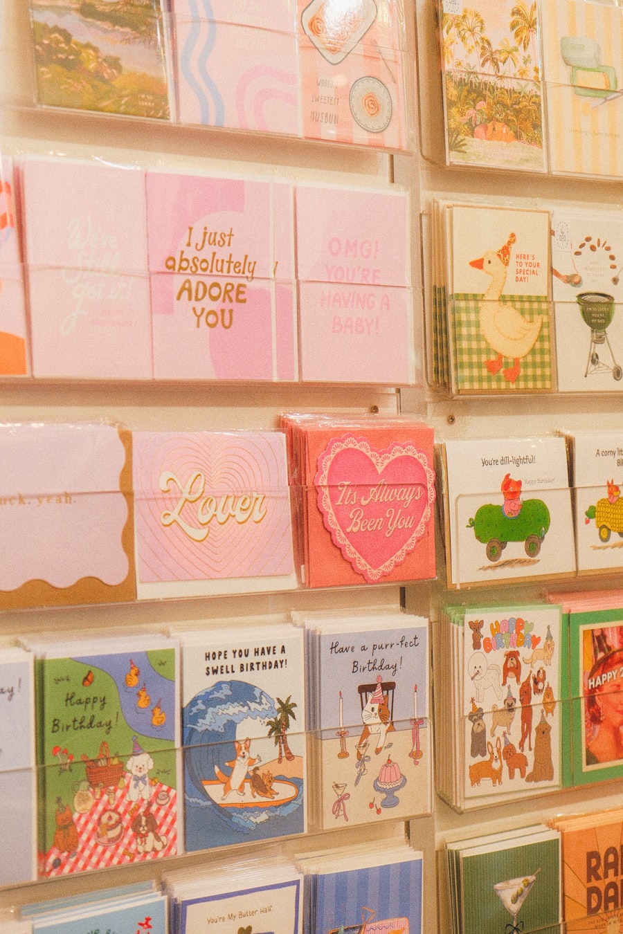 A stack of letterpress greeting cards fanned out on a table