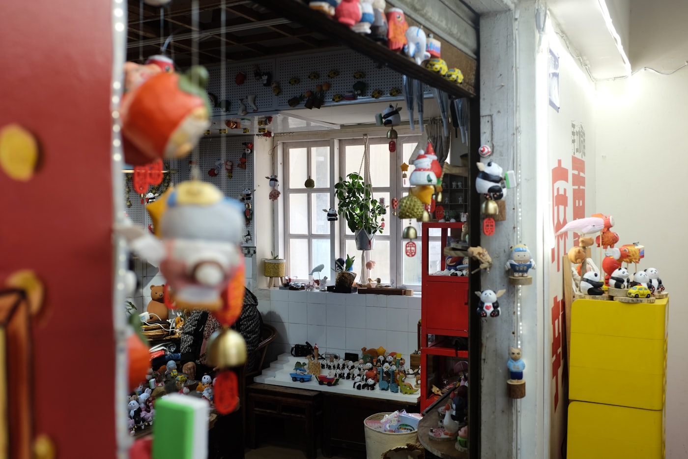 A close-up of a store shelf stacked with small gifts and curiosities