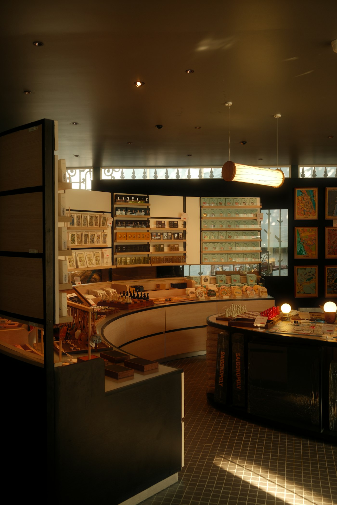 A shop interior with wooden shelves full of gifts, cards and candles