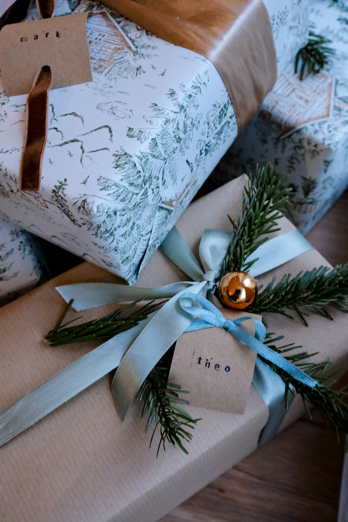 Wrapped gifts with ribbons and handwritten name tags
